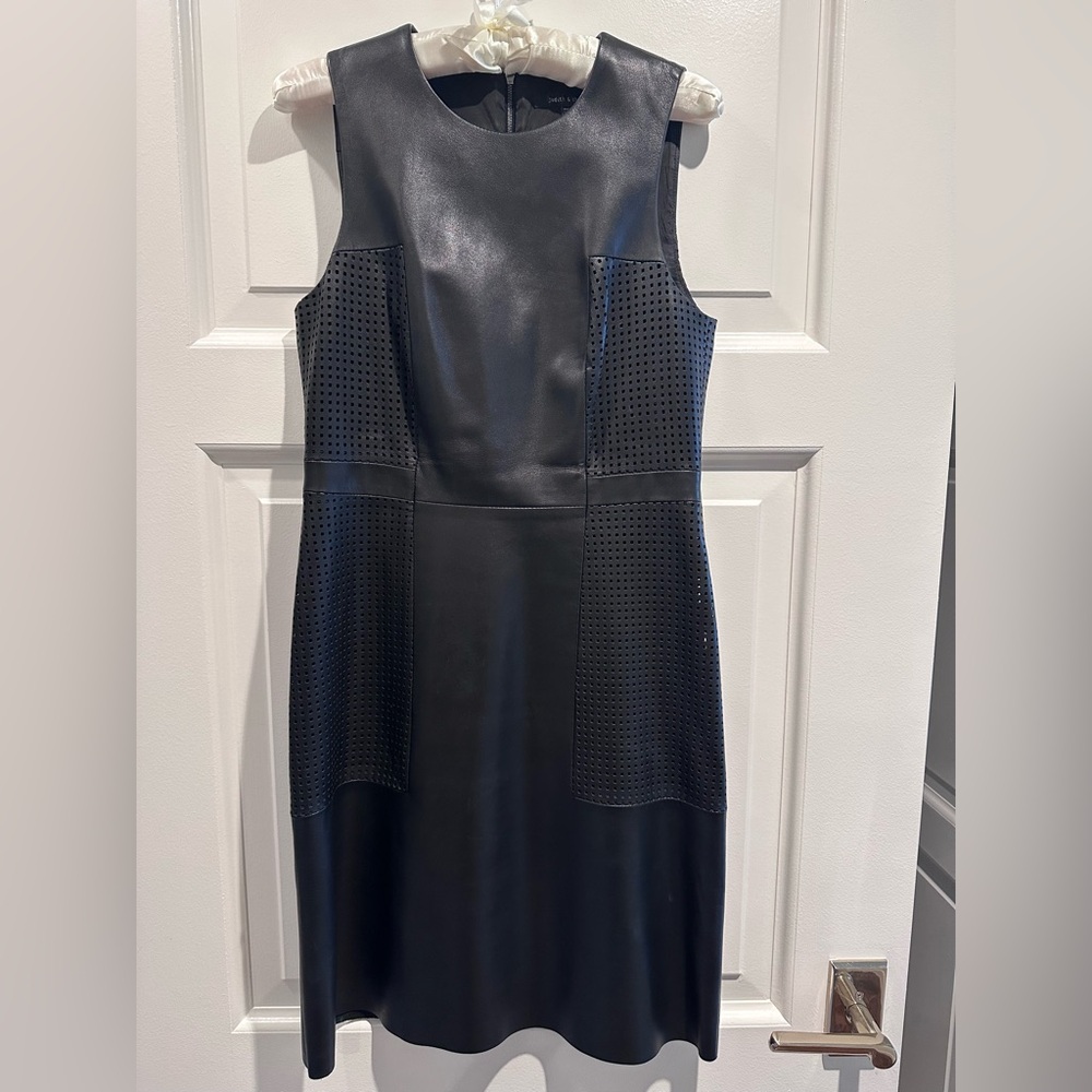 Judith and Charles Black Leather Dress with perforated details throughout.